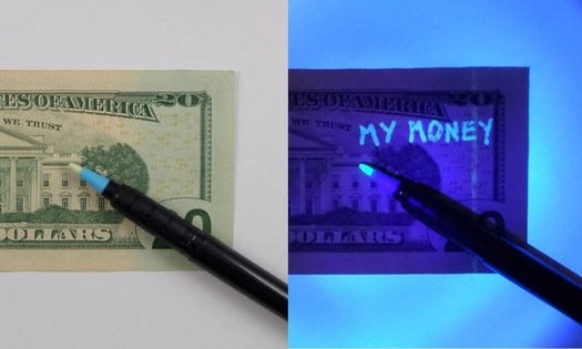 dollar bill with invisible ink mark