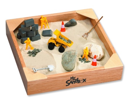 sandbox with construction toys