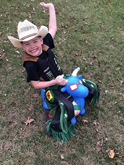 kid on bull riding toy