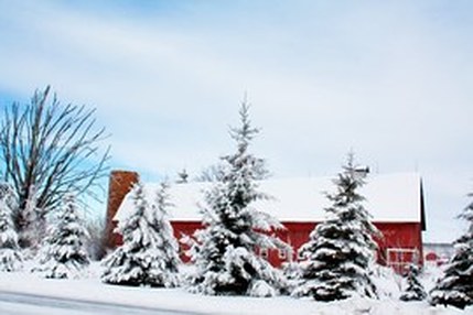 red barn in winter snow