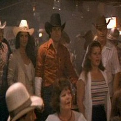 Me walking in front of John Travolta In The Movie Urban Cowboy